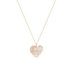 Goldene Diamantkette mit Herz auf Perlmuttplatte Goldene Diamantkette mit Herz auf Perlmuttplatte