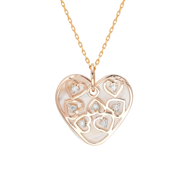 Goldene Diamantkette mit Herz auf Perlmuttplatte